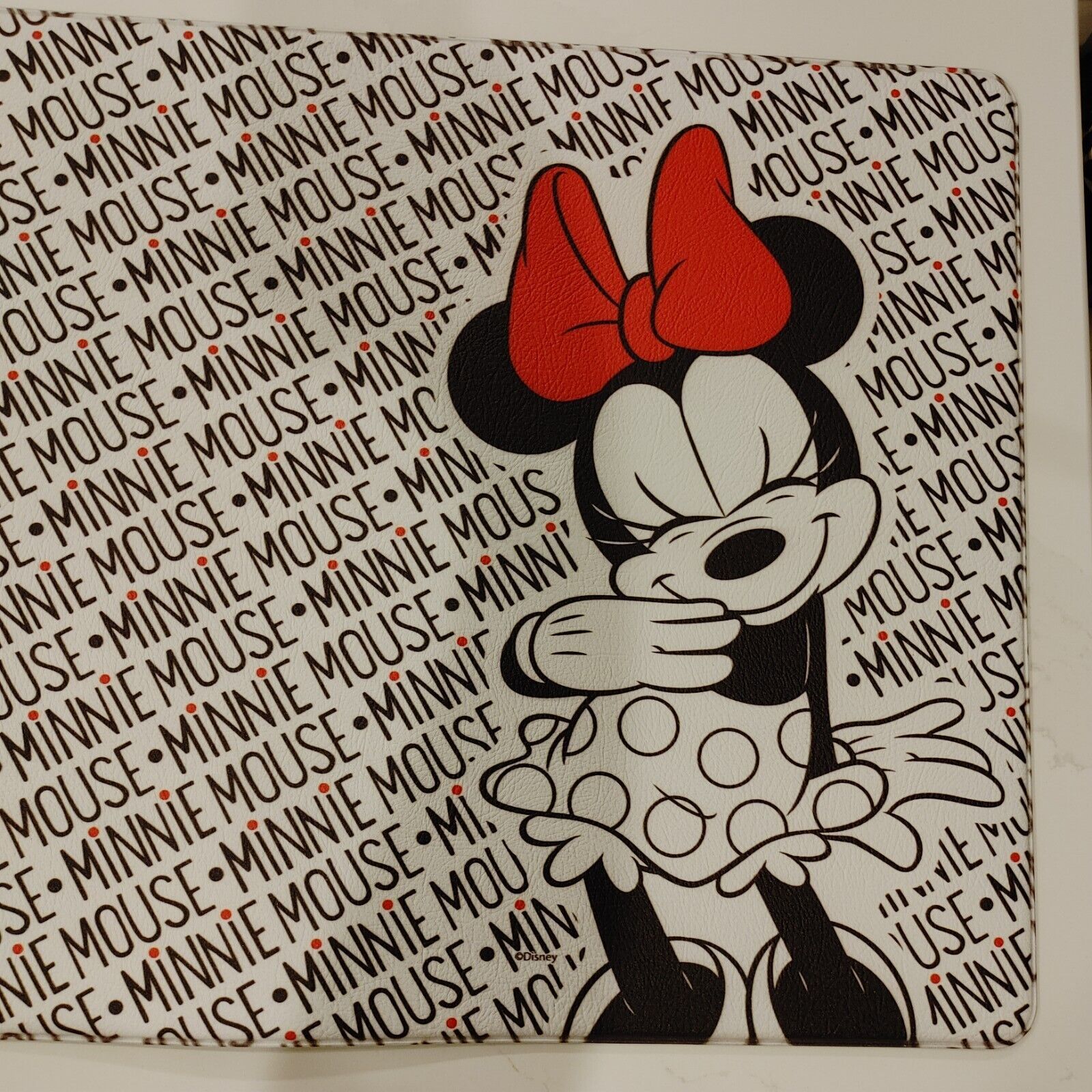 A mouse with red bow on her head - Minnie Mouse