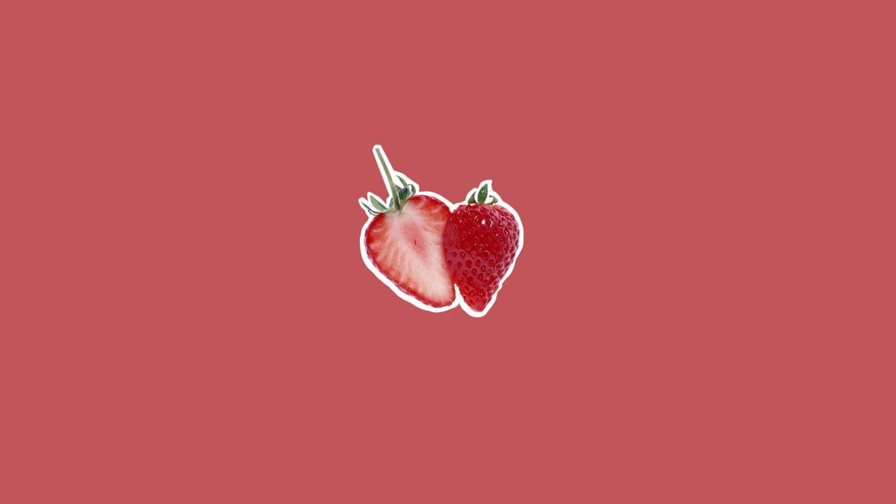 A strawberry on red background - Strawberry