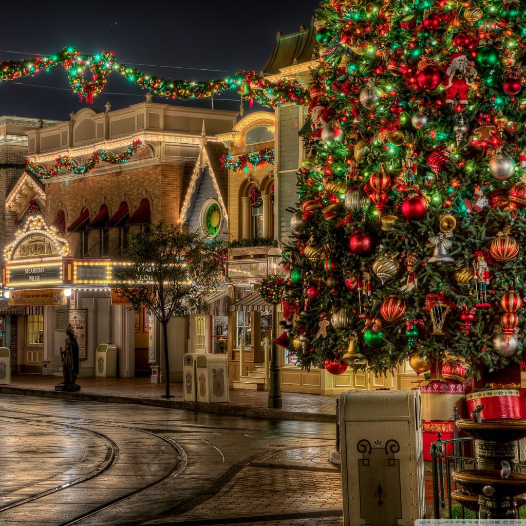 A christmas tree in front of an old building - Disneyland