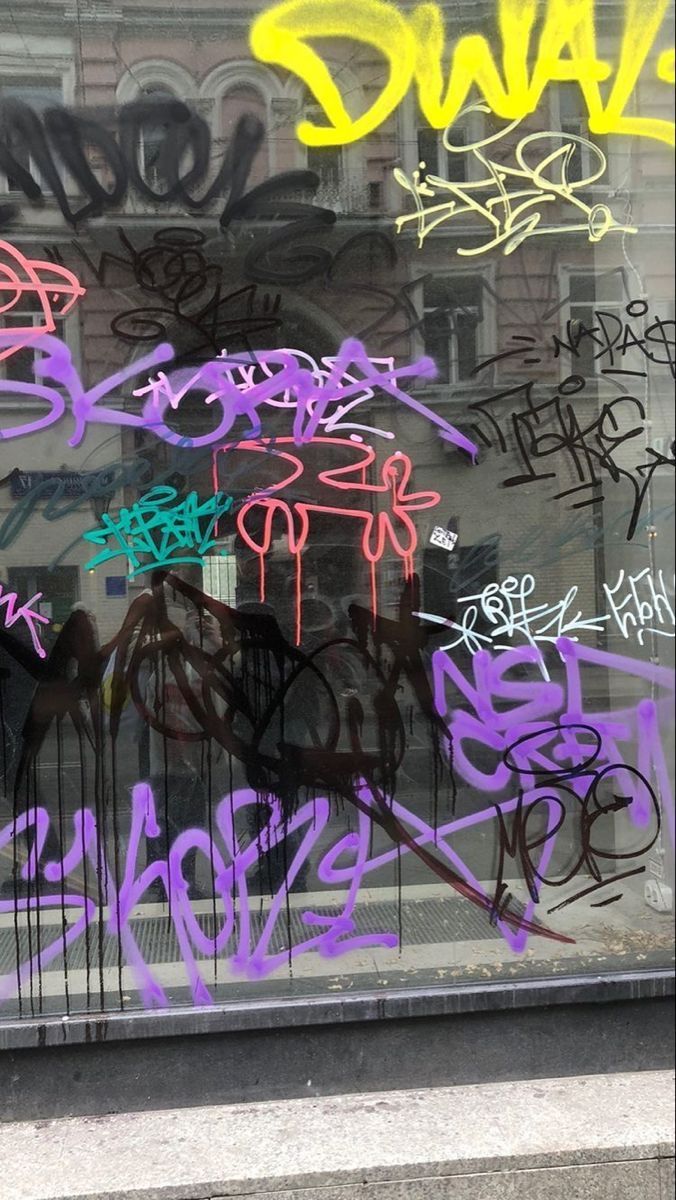 Graffiti on a window in SoHo, New York City - Graffiti, street art