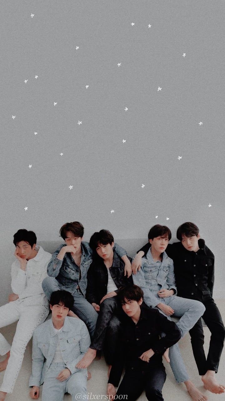 BTS in a white room with white stars in the background - BTS