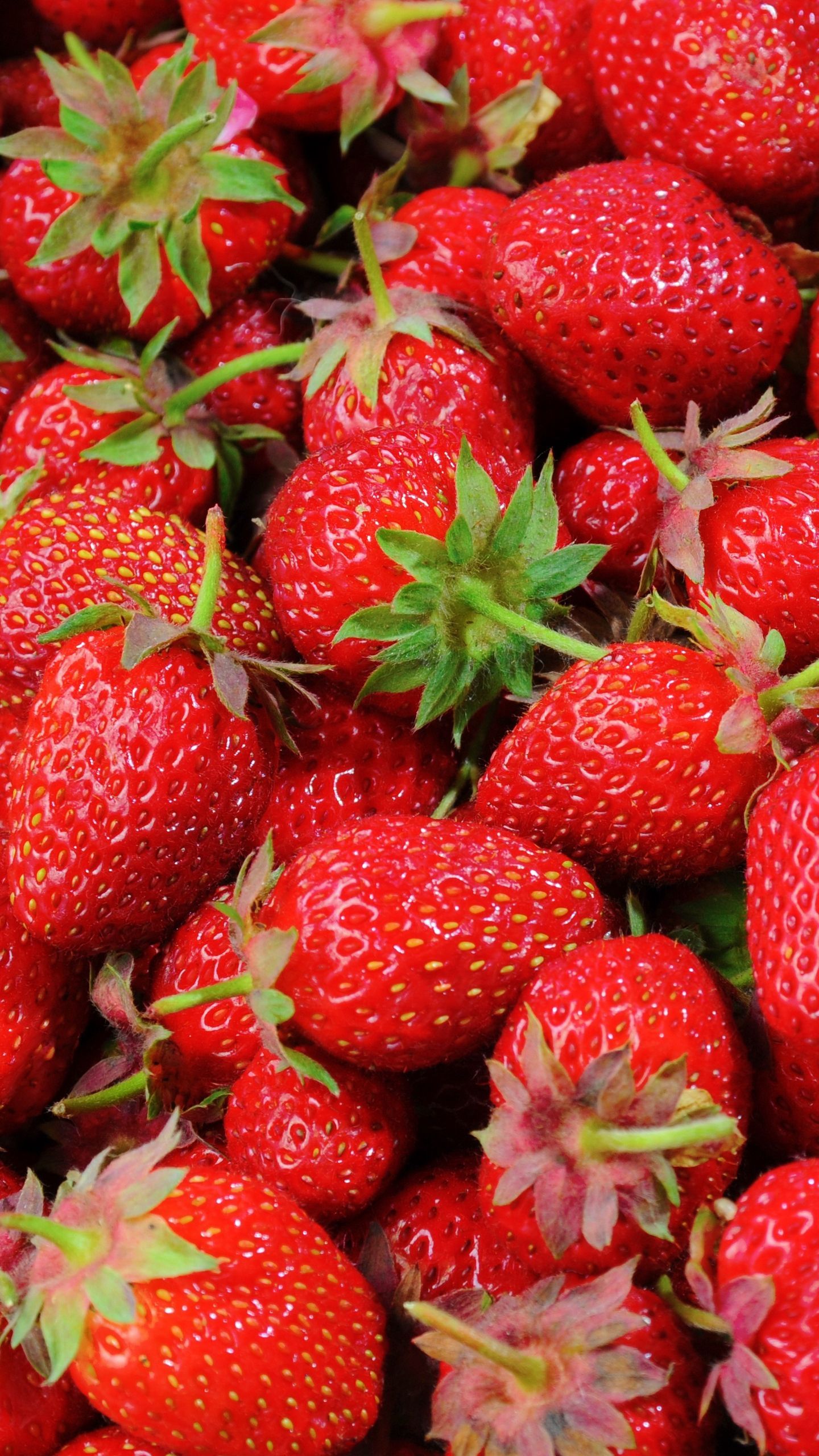 A close up of some strawberries that are red - Strawberry