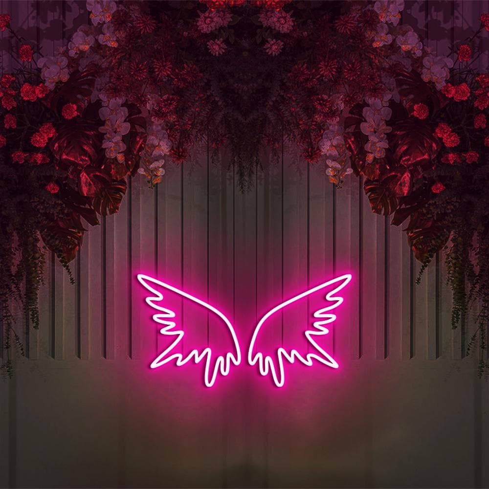 A neon sign with two pink wings - Neon pink