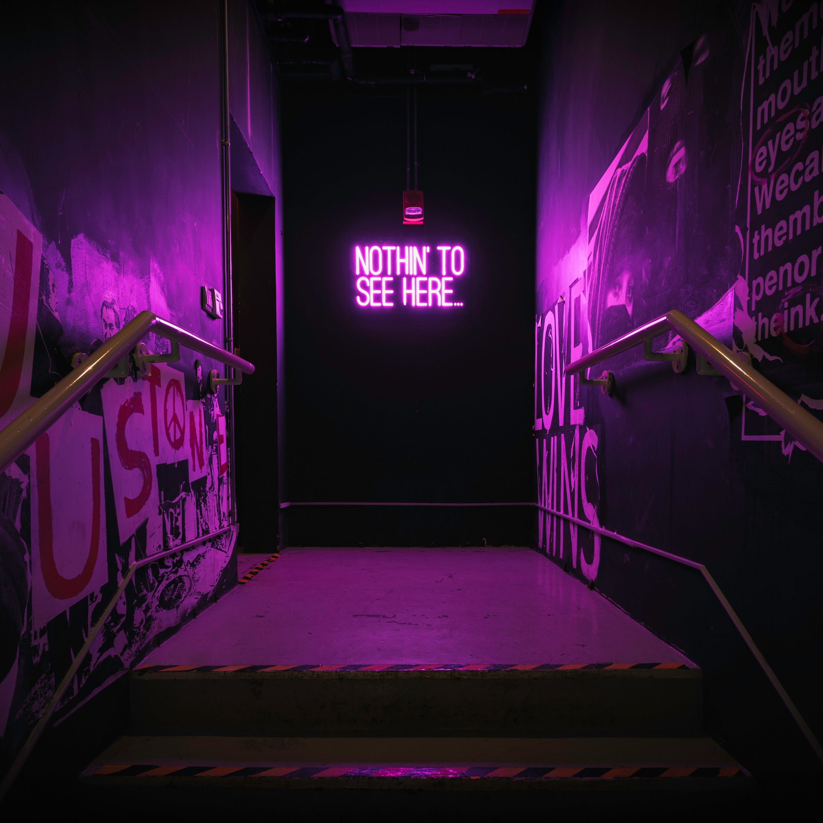 A stairway leading to an art exhibit - Neon pink, purple quotes, neon purple, light purple