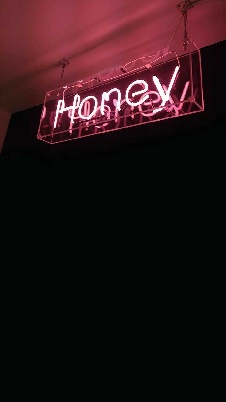 A pink neon sign that says honey - Neon pink
