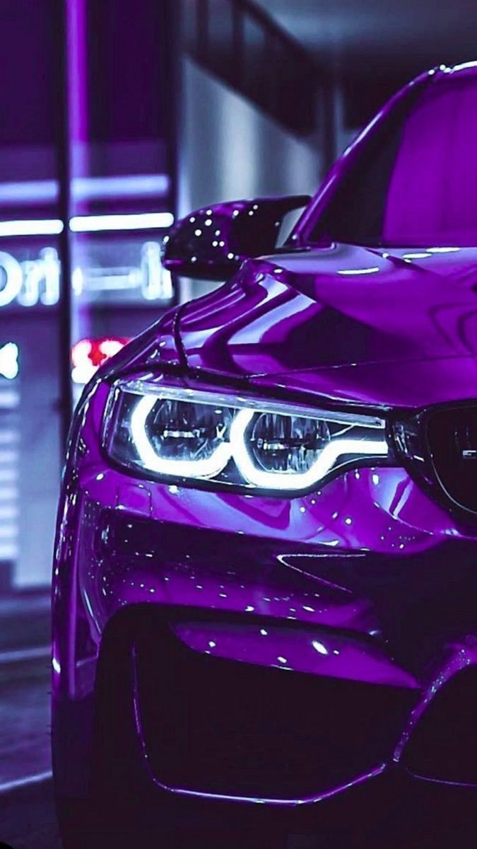 IPhone wallpaper of a purple car with headlights on. - BMW
