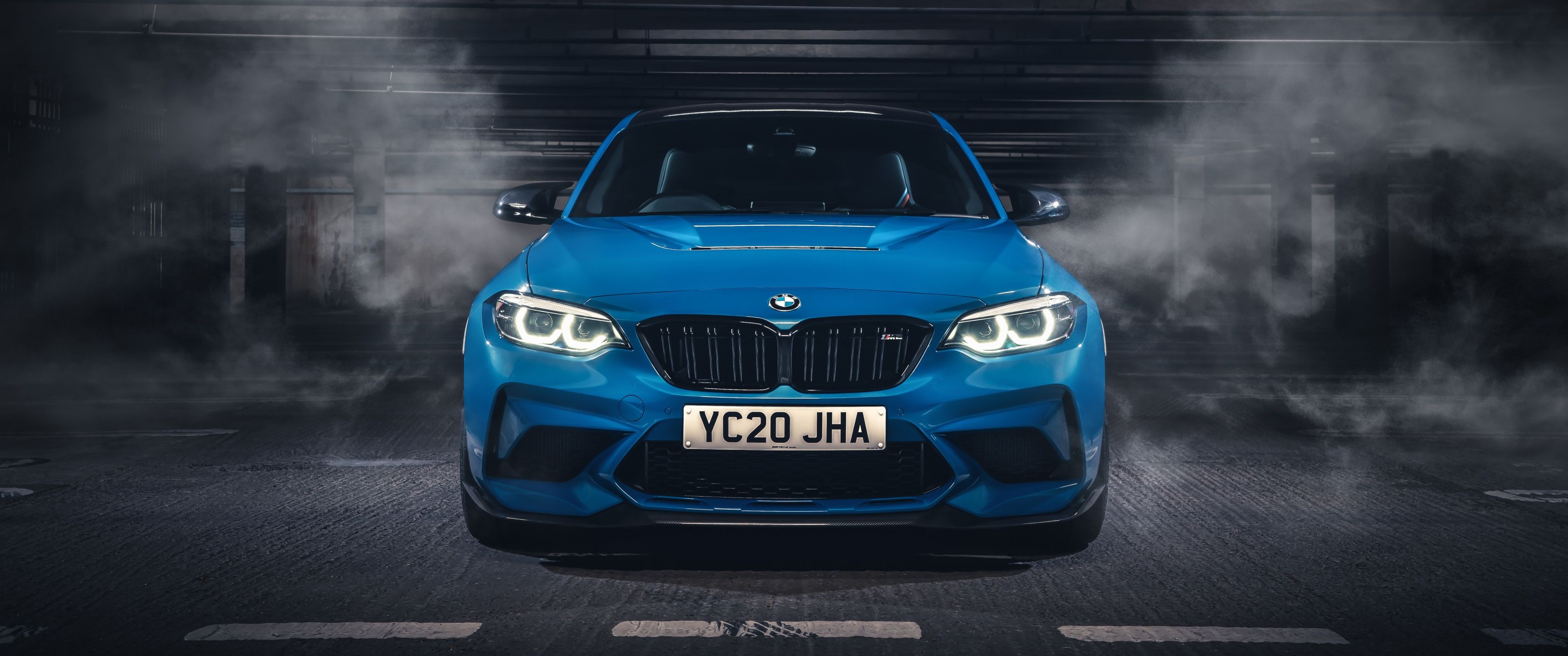 The bmw m2 coupe is parked in a dark garage - BMW