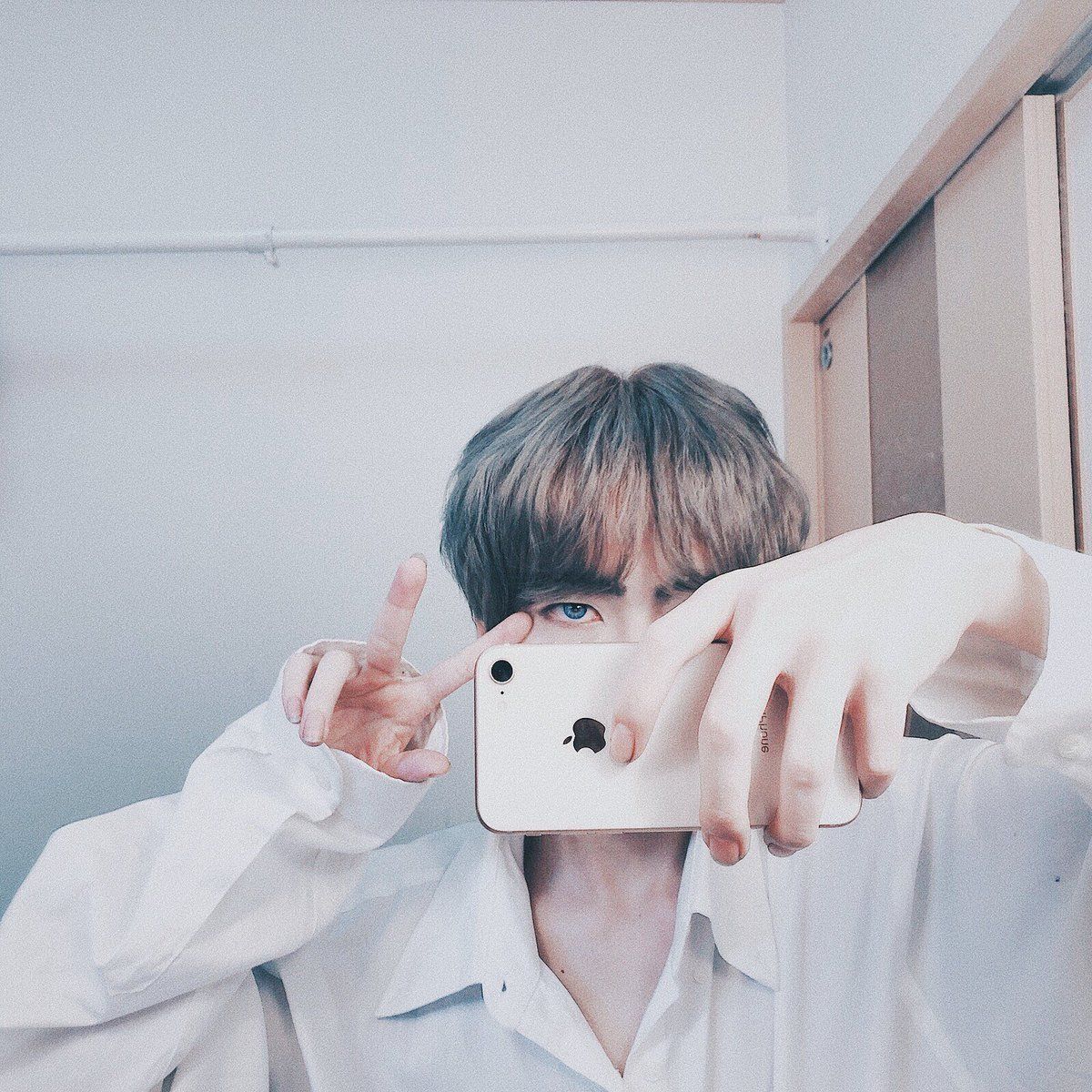 A man taking selfie with his phone - BTS