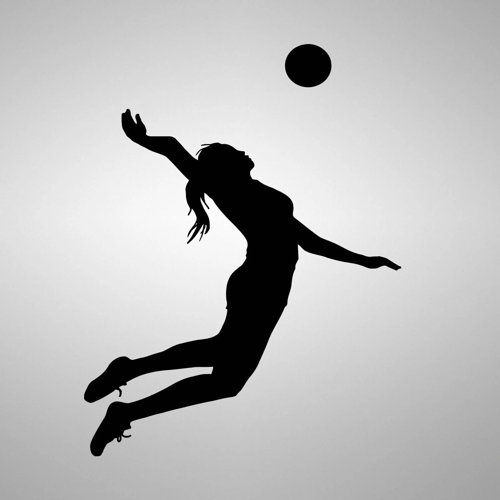 A silhouette of the woman jumping to hit volleyball - Volleyball