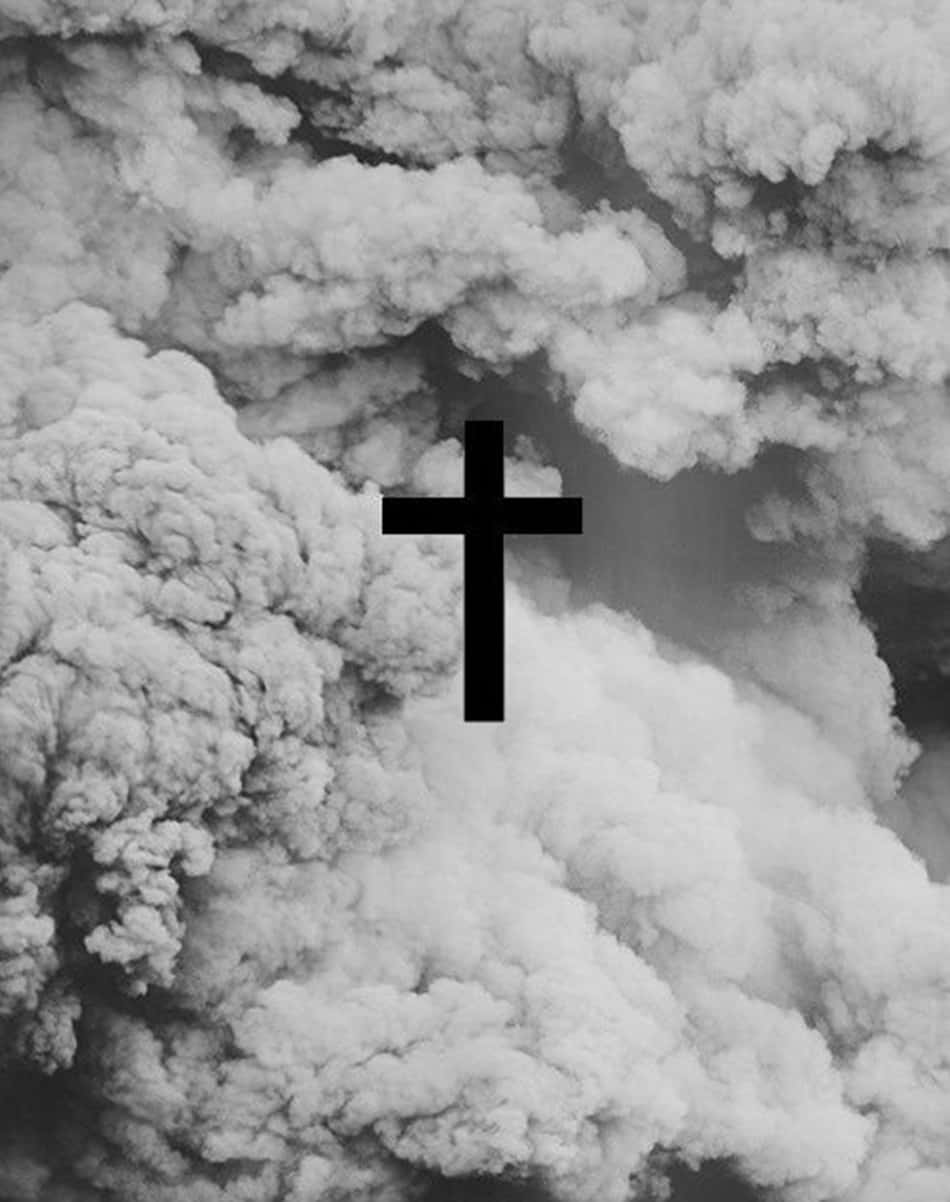 A black and white photo of the cross in front - Cross