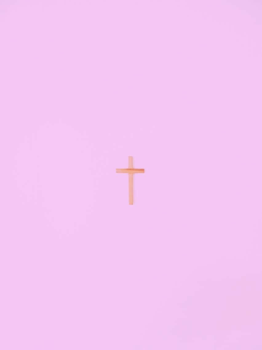 A cross on top of pink background - Cross