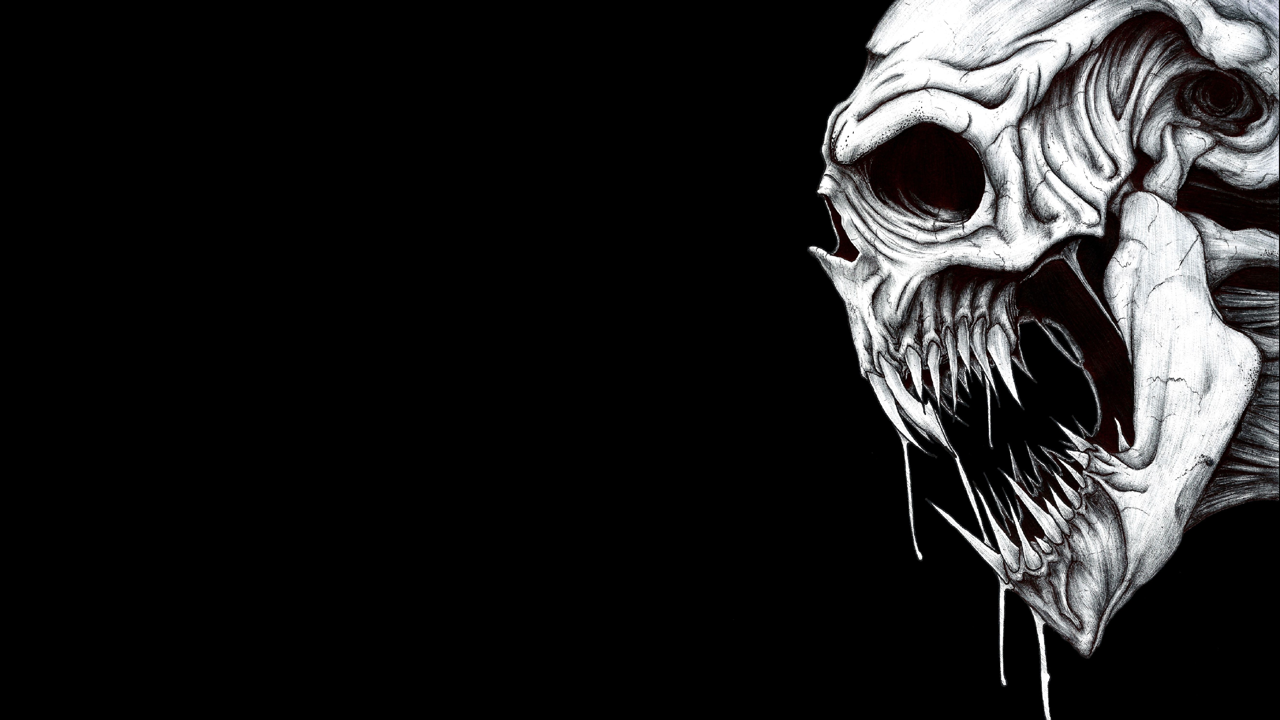 A black and white image of an evil skull - Skull