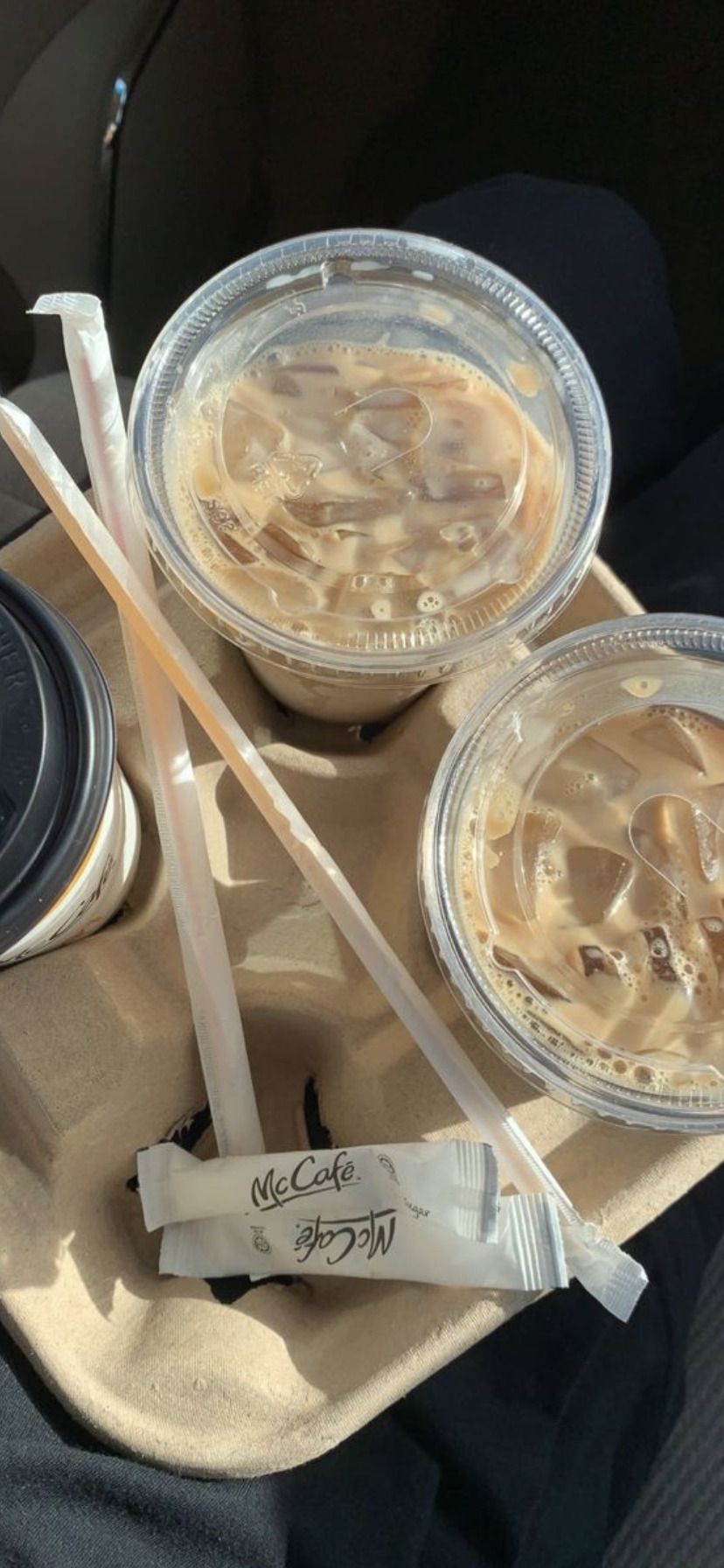 A tray of food with straws and cups - Coffee