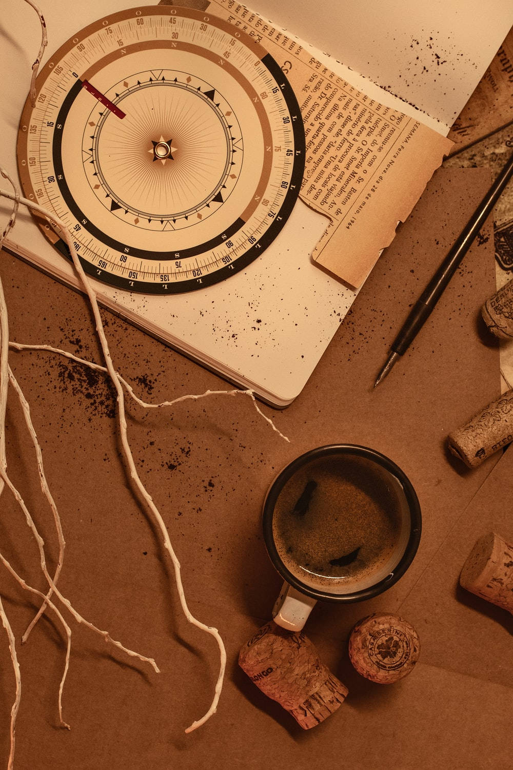 A compass, pencil and cup of coffee on top - Brown, coffee, flat lay