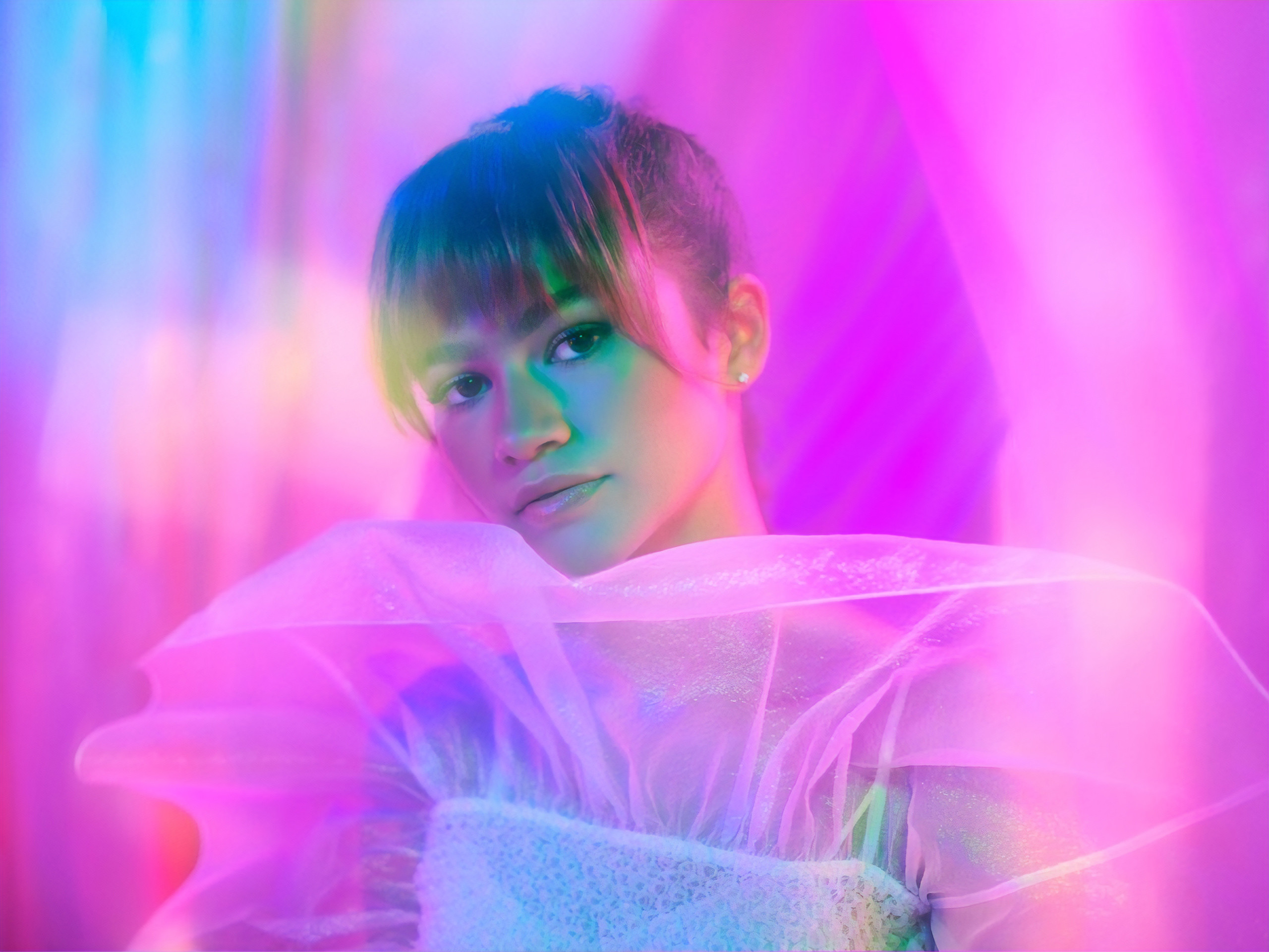 A woman in colorful clothing poses for the camera - Euphoria