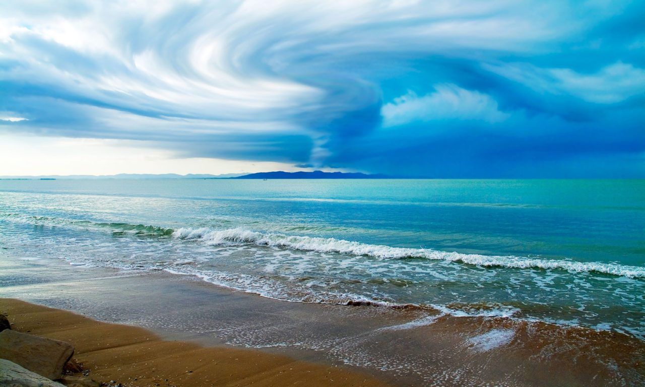 Swirling Clouds Above The Ocean Beach Wallpaper 2560x1600 : Wallpaper13.com