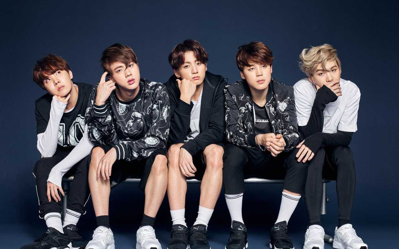 BTS is a South Korean boy band that has gained immense popularity in recent years. - BTS