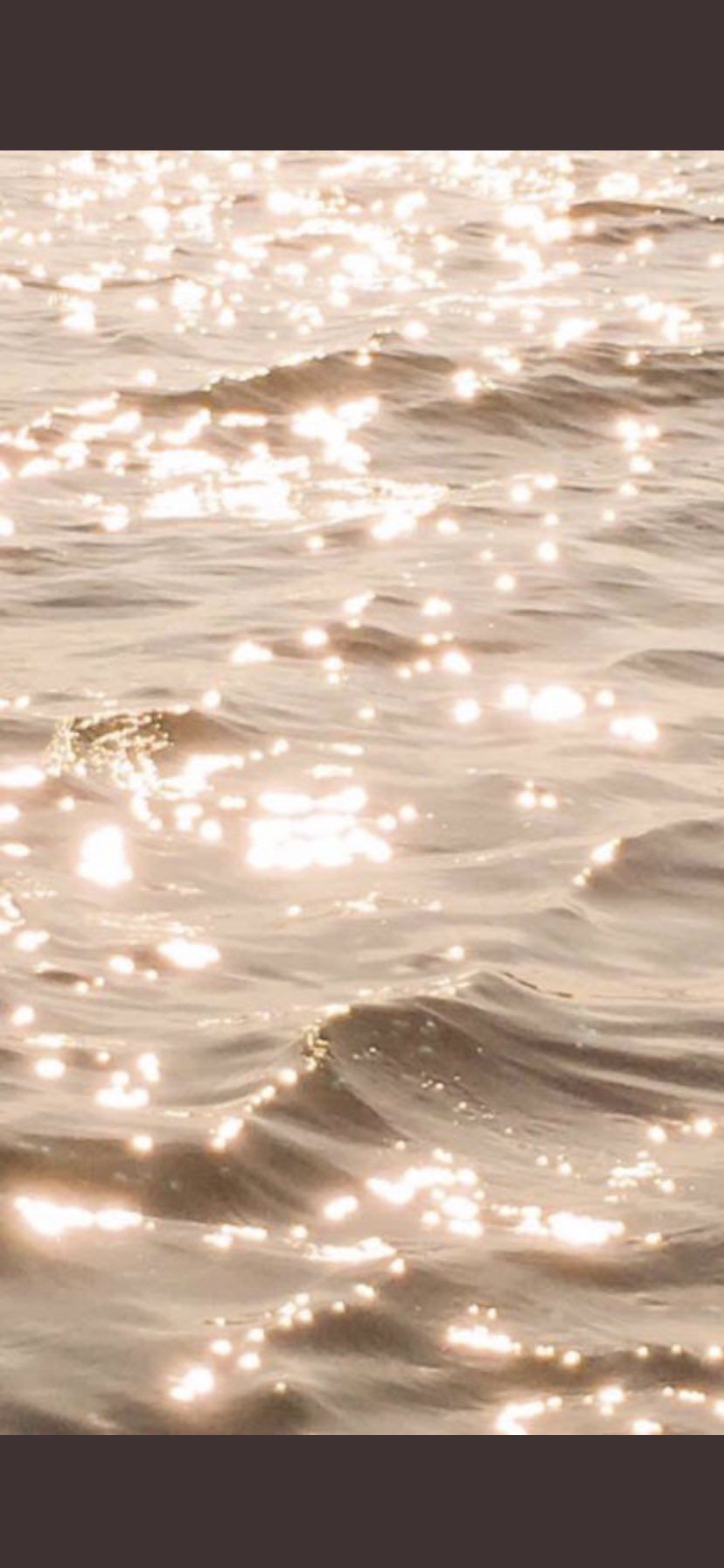 A close up of the water on a beach - Gold