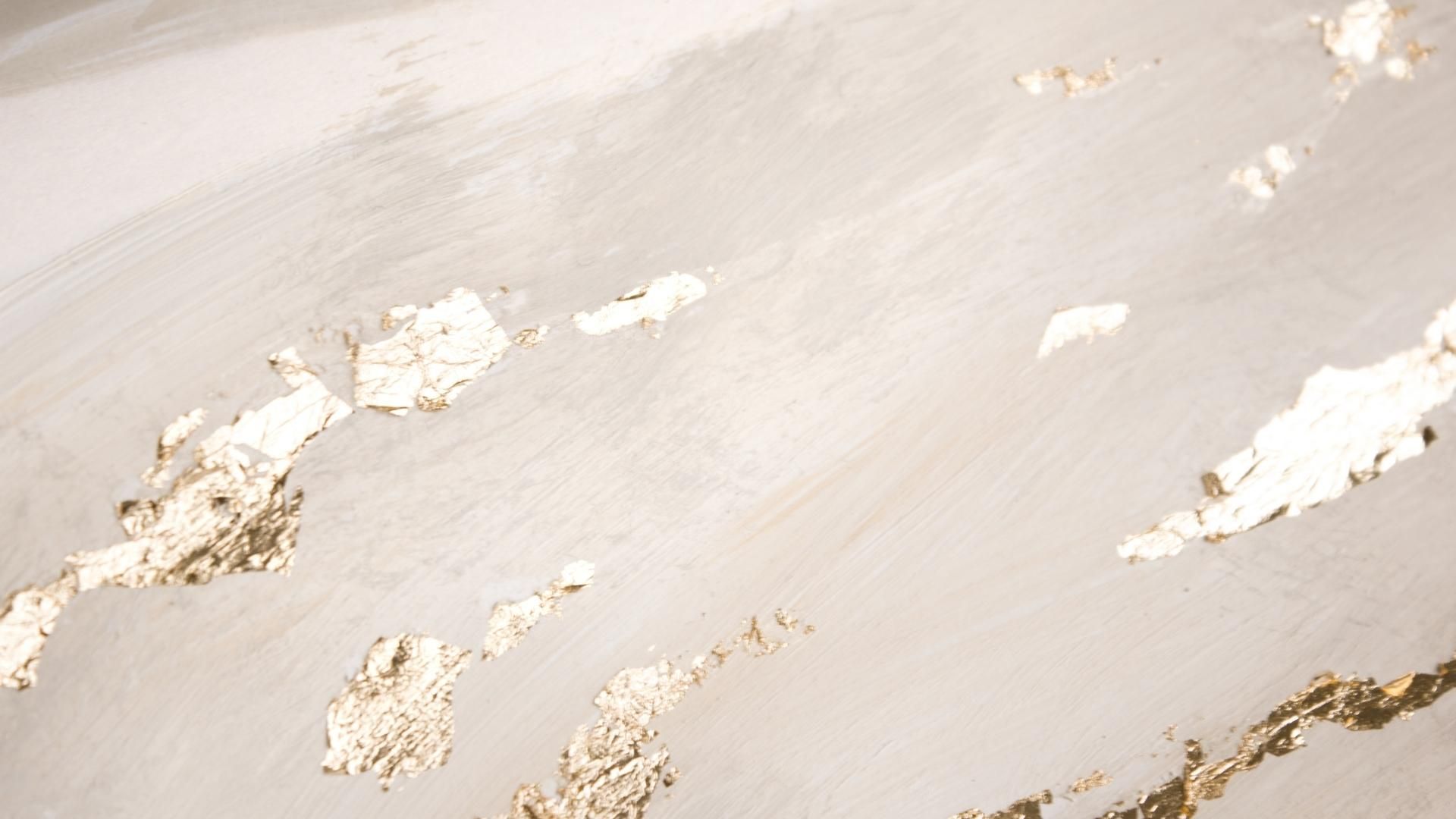 A white and gold marble surface - Gold