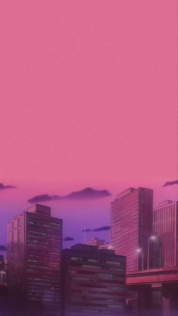 A city skyline at sunset with pink clouds - City