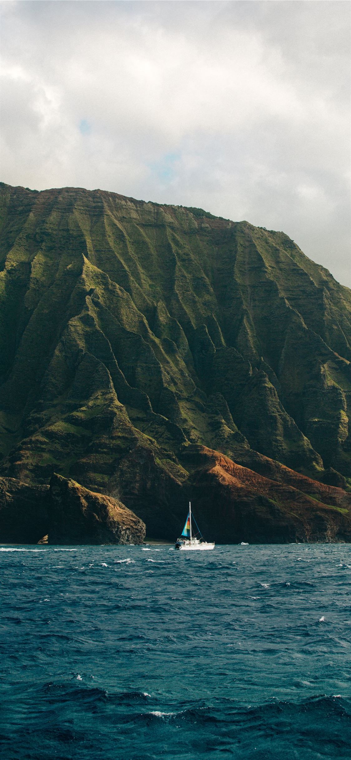 A sailboat is in the water - Hawaii