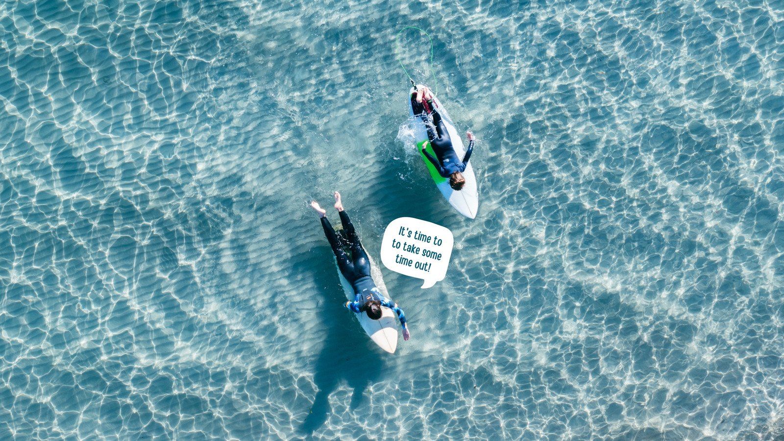 Two surfers on surfboards in the ocean - Surf