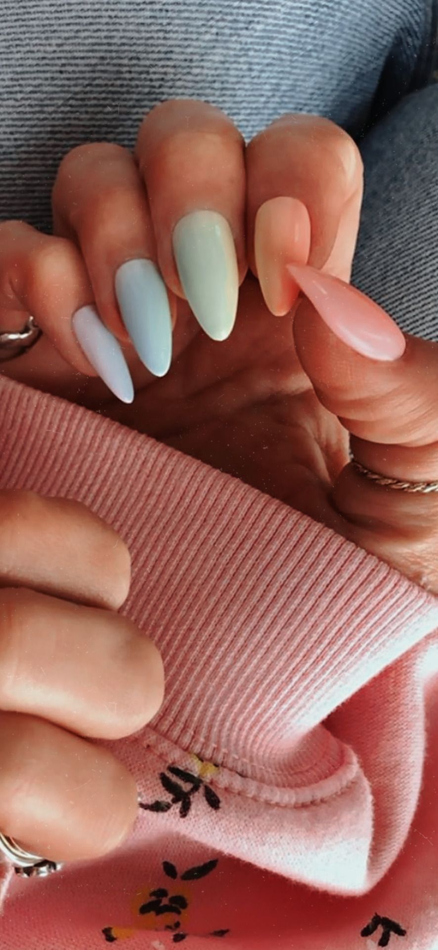 A woman with long nails and a sweater - Nails