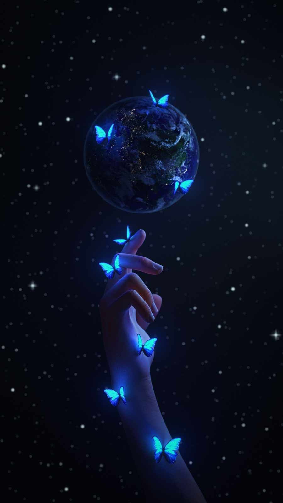 A woman's hand holding up the earth with glowing butterflies - Earth