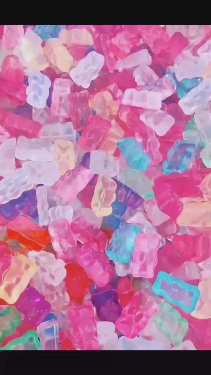 A pile of gummy bears in different colors - Candy