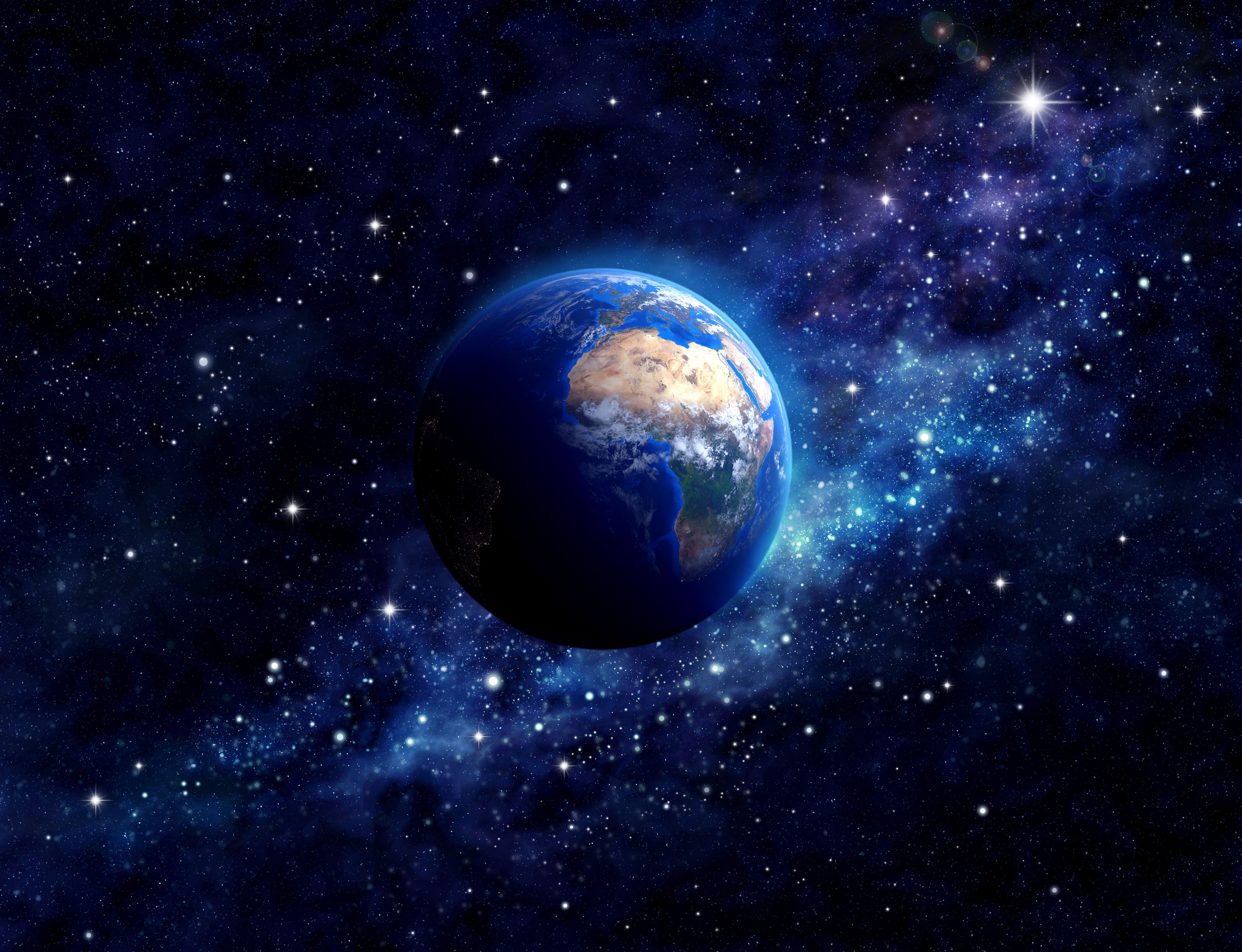 A planet is surrounded by stars and space - Earth