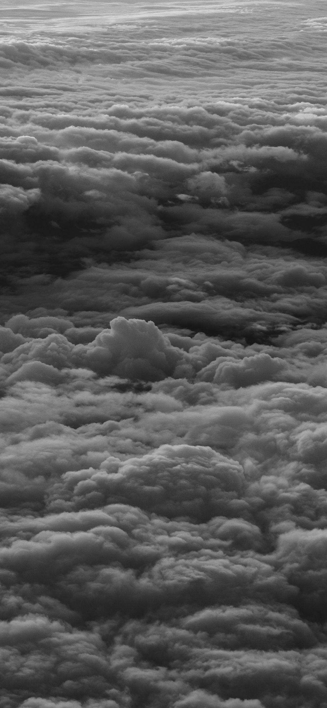 Black and white photo of clouds from an airplane - Earth