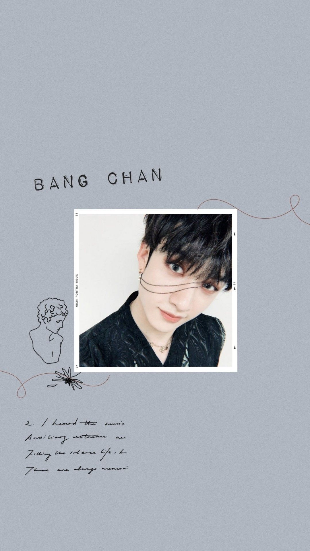 A picture of an asian man with black hair - Bang Chan