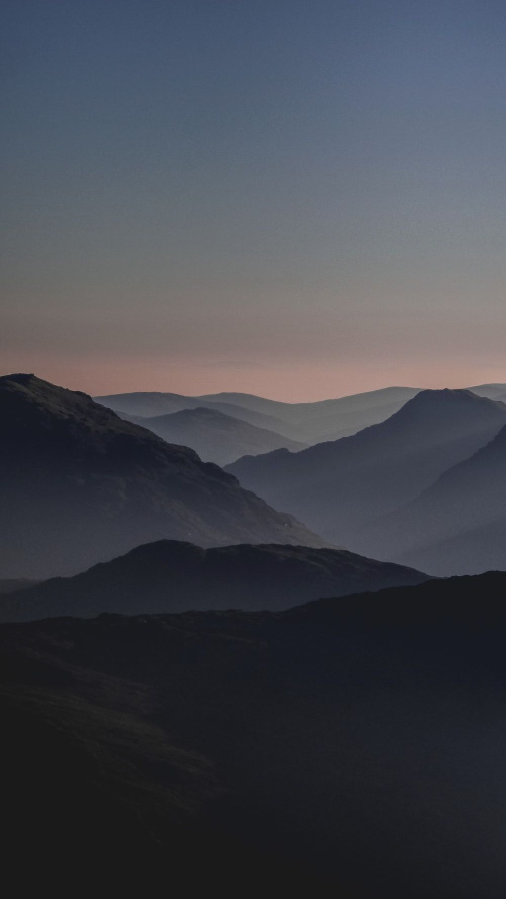 A photo of a mountain range at sunset - Mountain