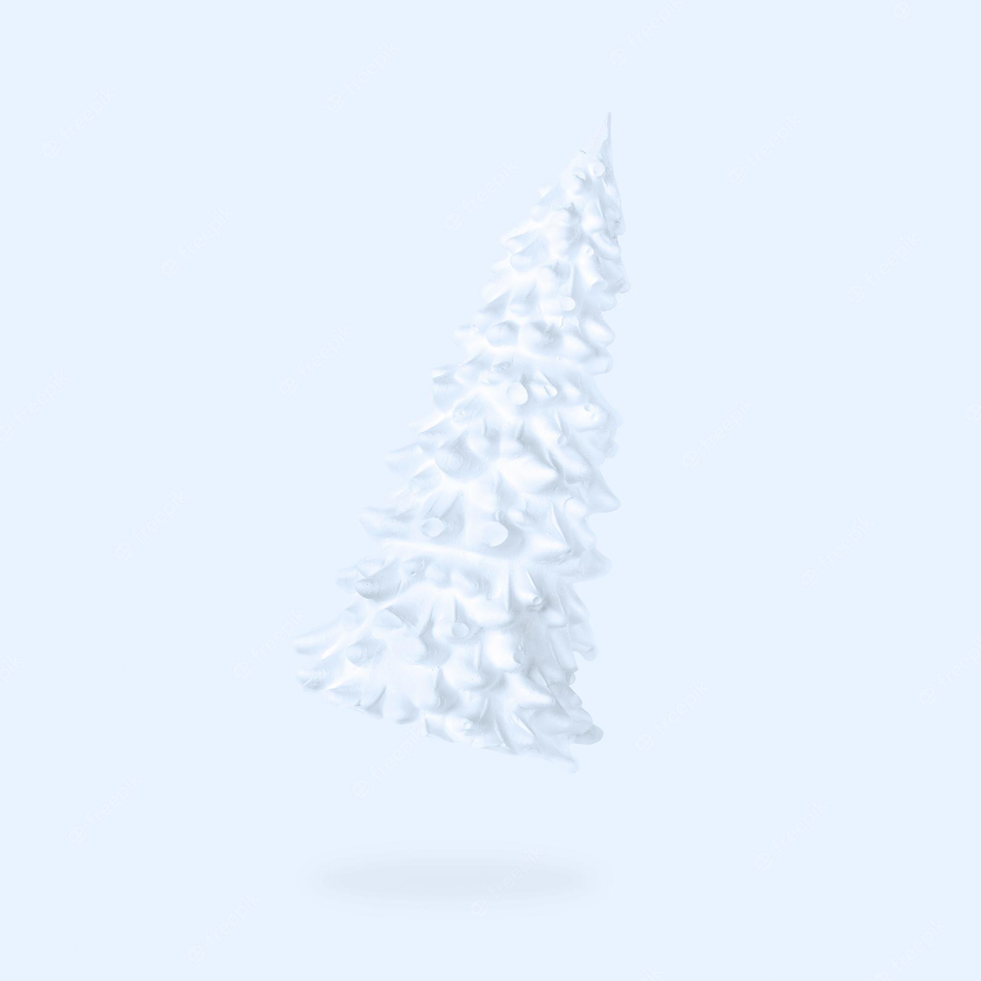 A white christmas tree is on the ground - White Christmas