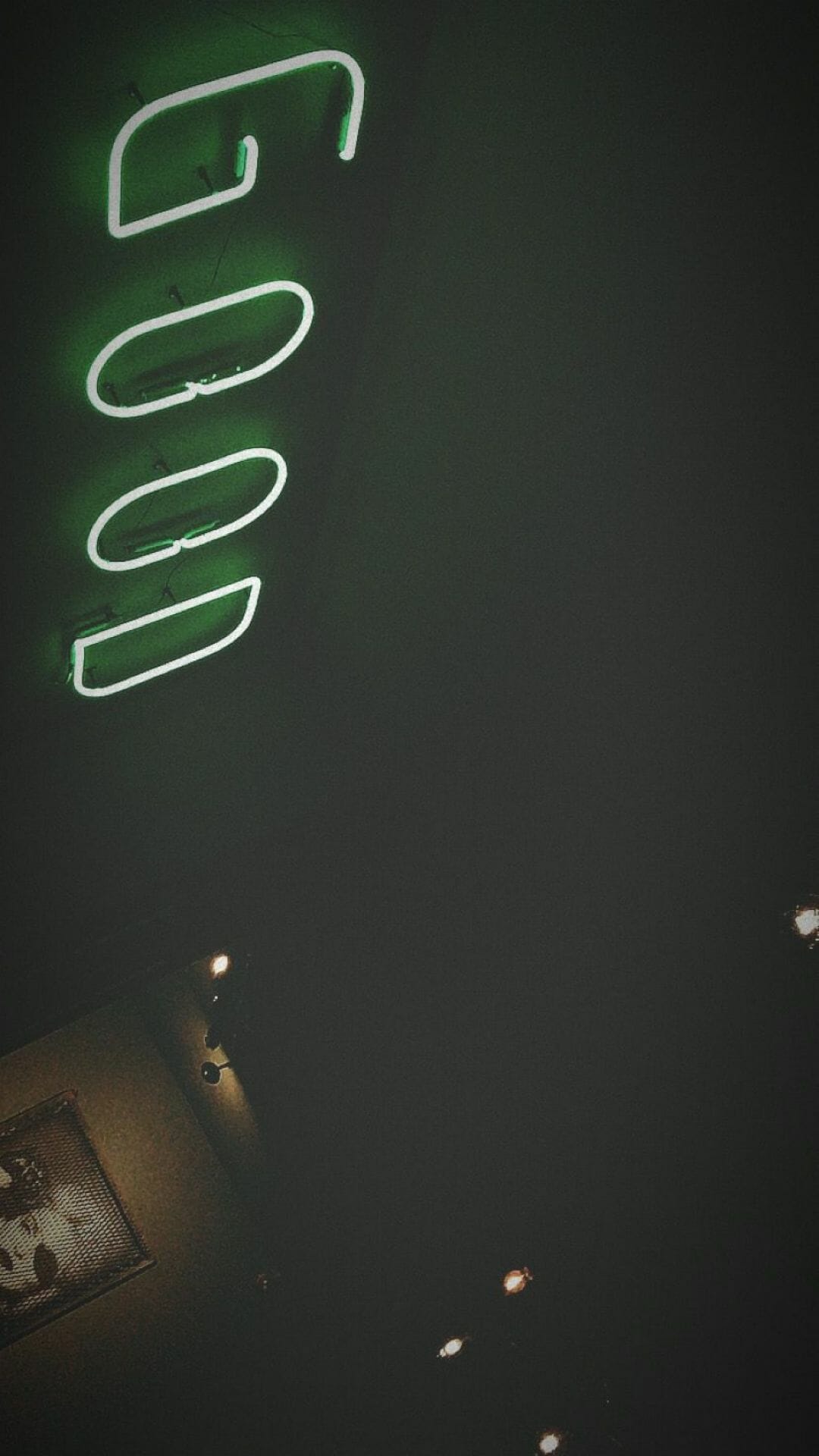 A neon sign that says good in the dark - Dark green, lime green, neon green