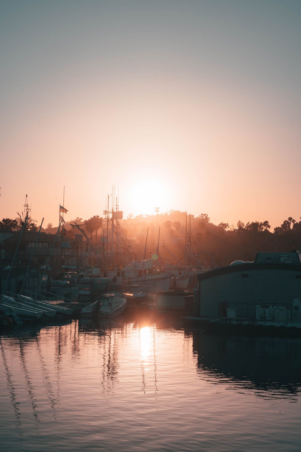 As a sunset over the water with boats - Sunrise