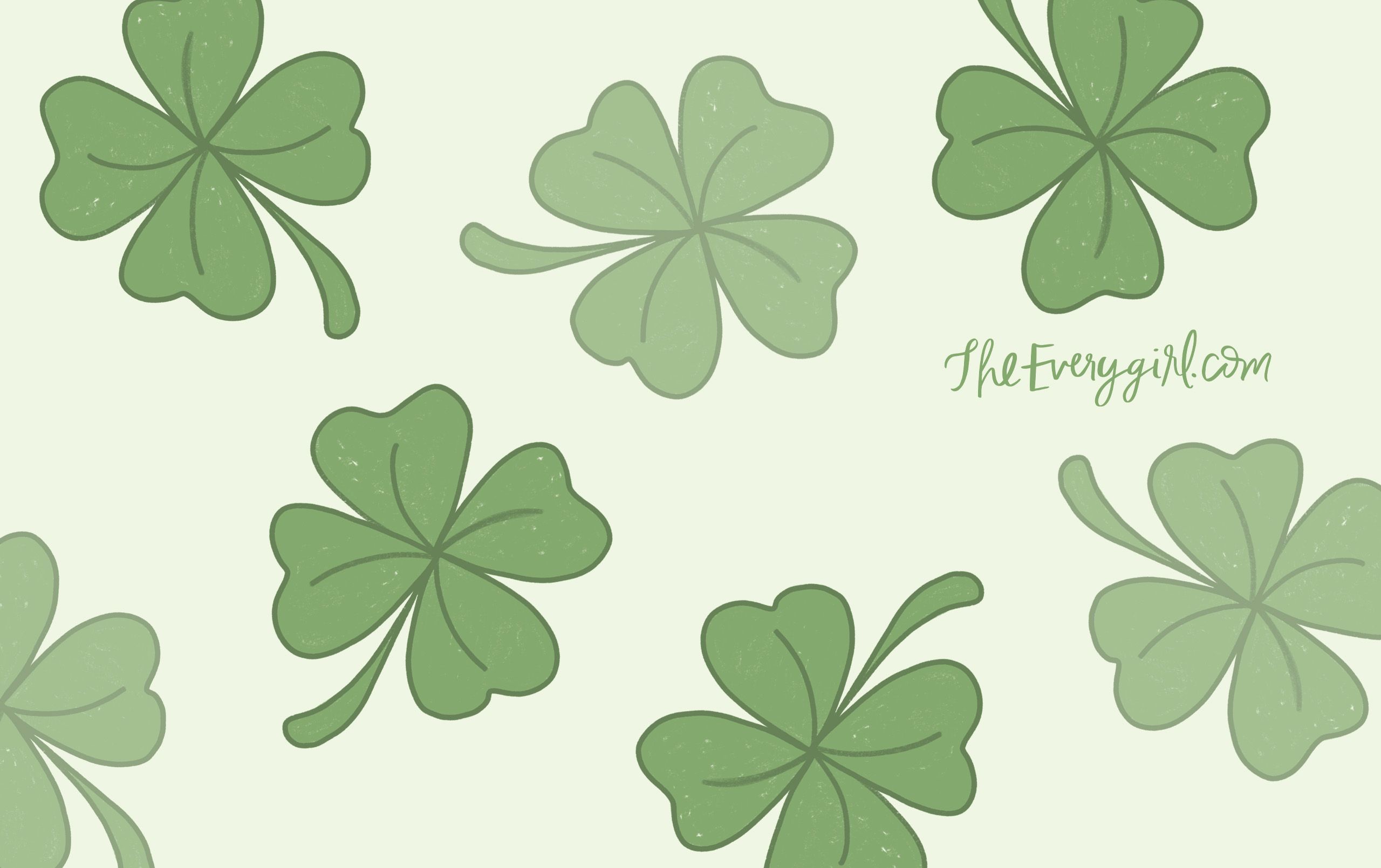A green clover leaf with the word shamrock - March
