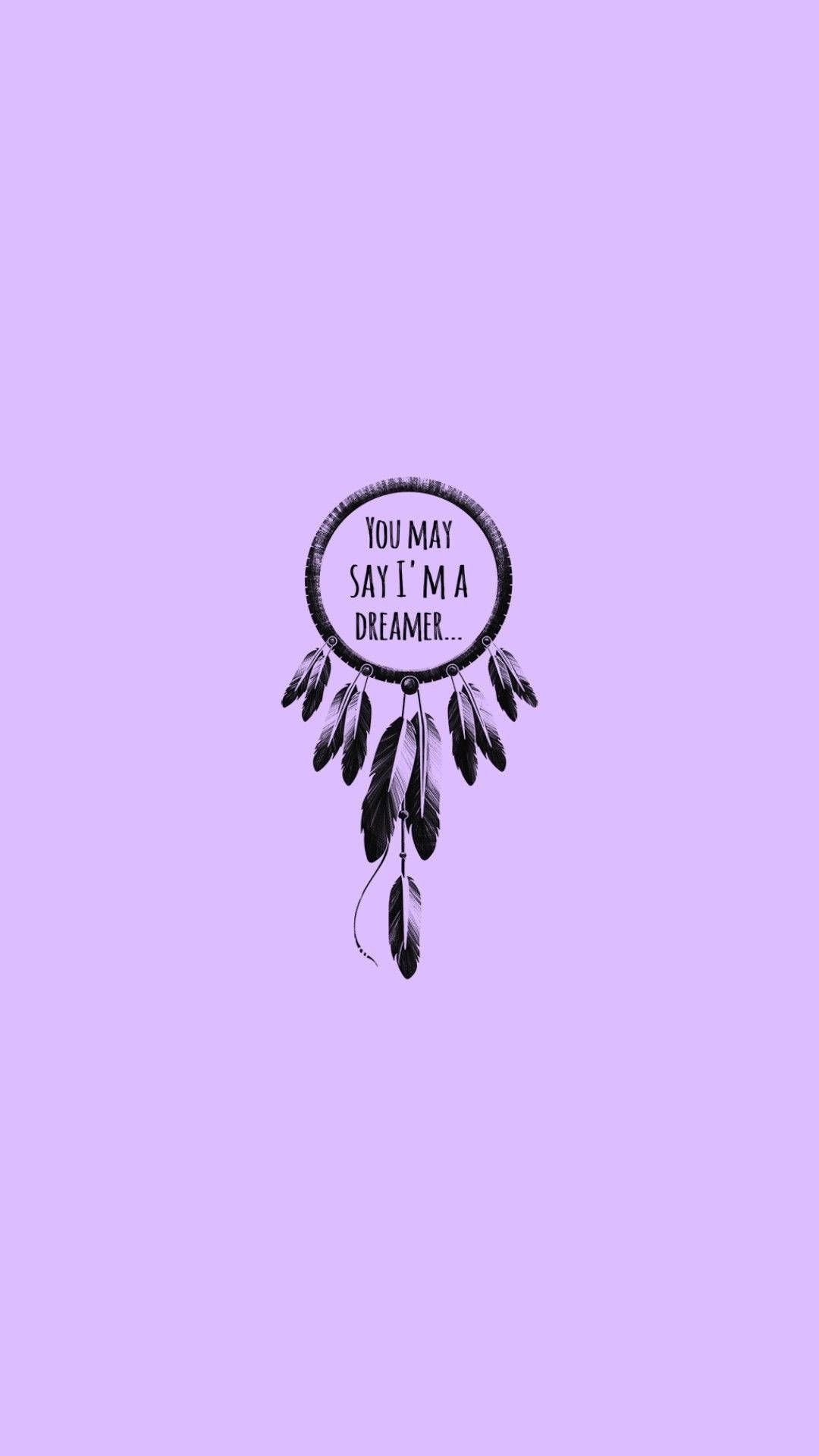 A purple background with a black dream catcher in the middle. The words 