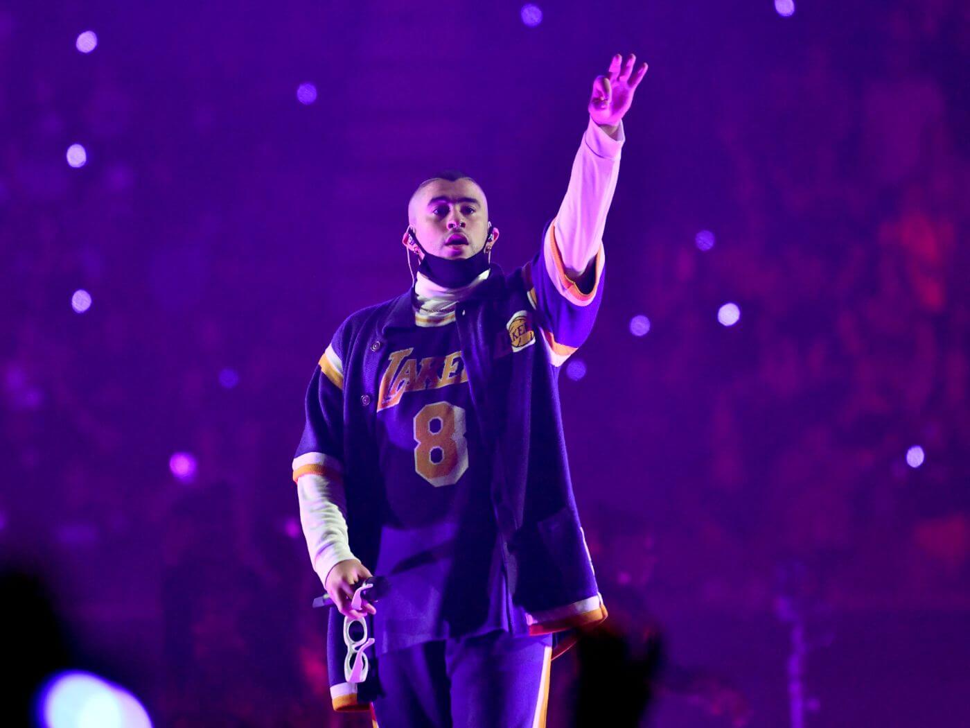 Rapper Mac Miller performs on stage wearing a Lakers jersey. - Bad Bunny