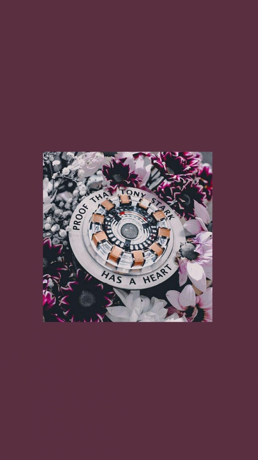 A phone wallpaper of the arc reactor from Iron Man with flowers in the background - Marvel, Avengers