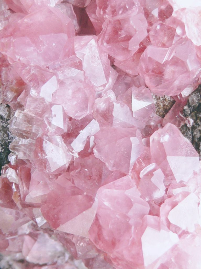 A close up of pink crystals on the ground - Pastel pink