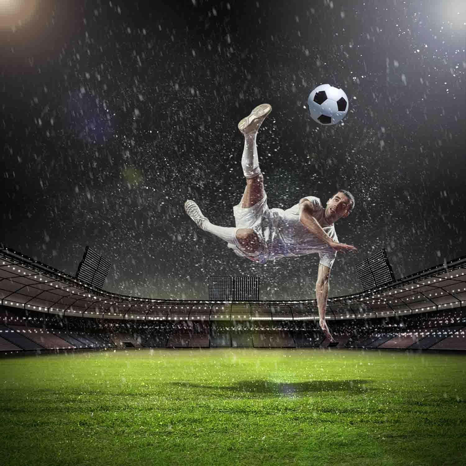 A soccer player in the air kicking a soccer ball - Soccer