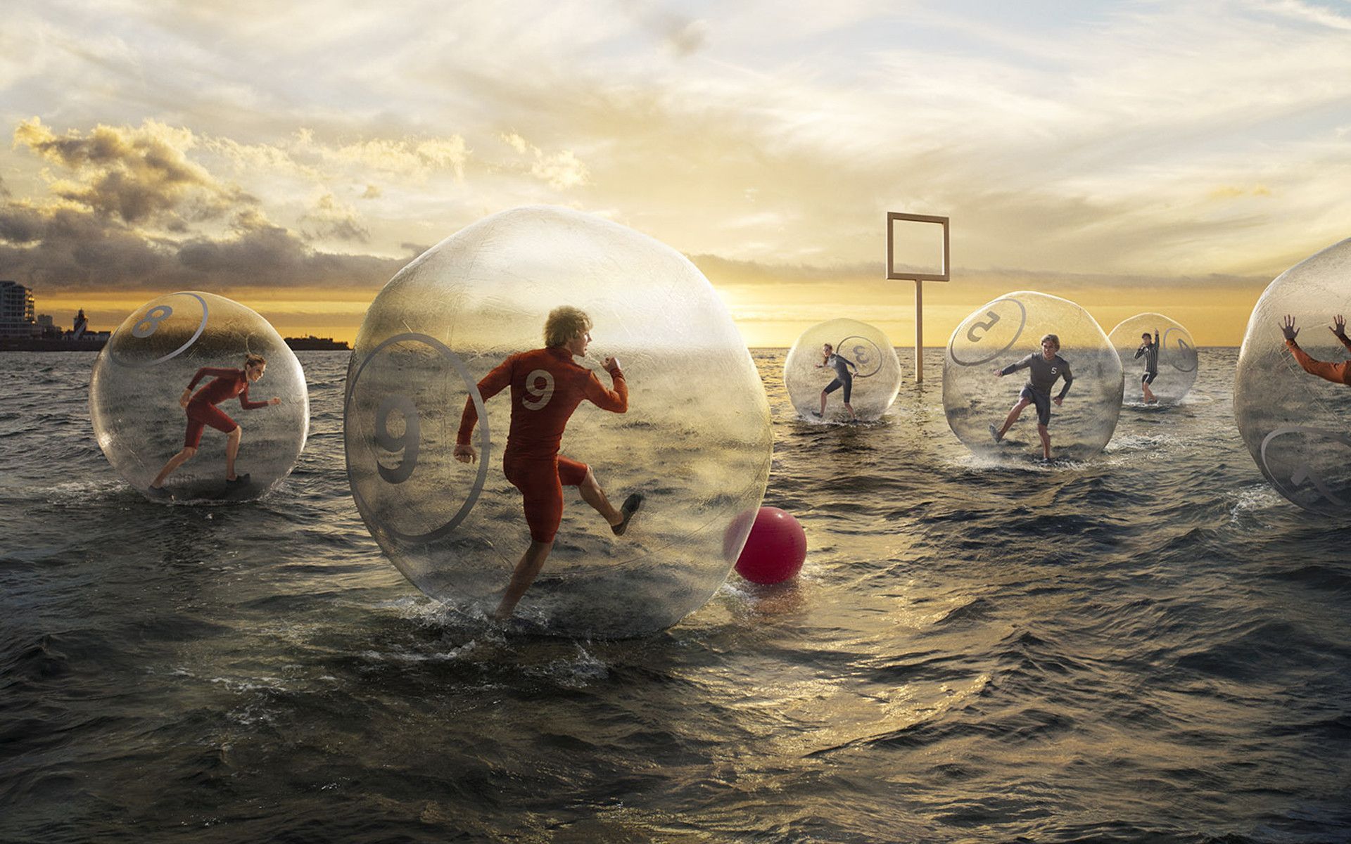 A group of people in bubbles playing soccer - Soccer