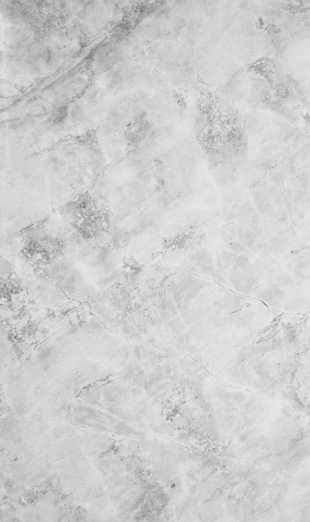 A close up of a white marble floor - Marble