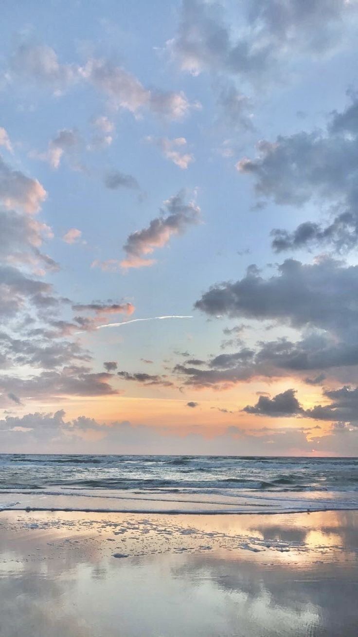 A sunset on the beach with clouds in it - Florida