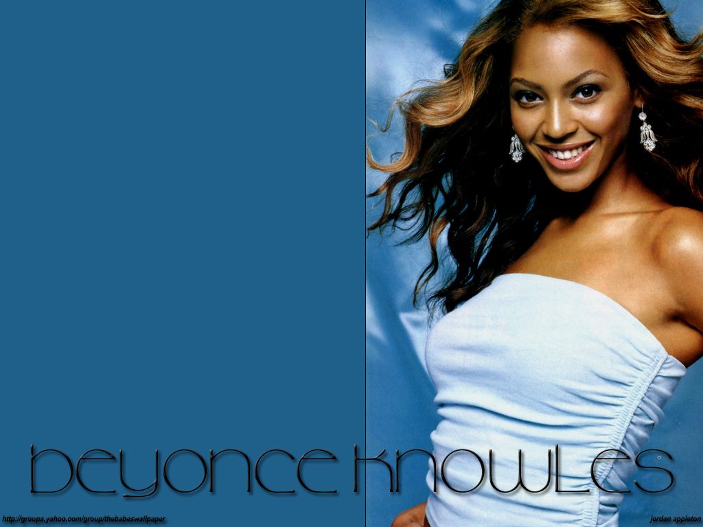 Beyonce wallpaper with the singer smiling and wearing a white top. - Beyonce