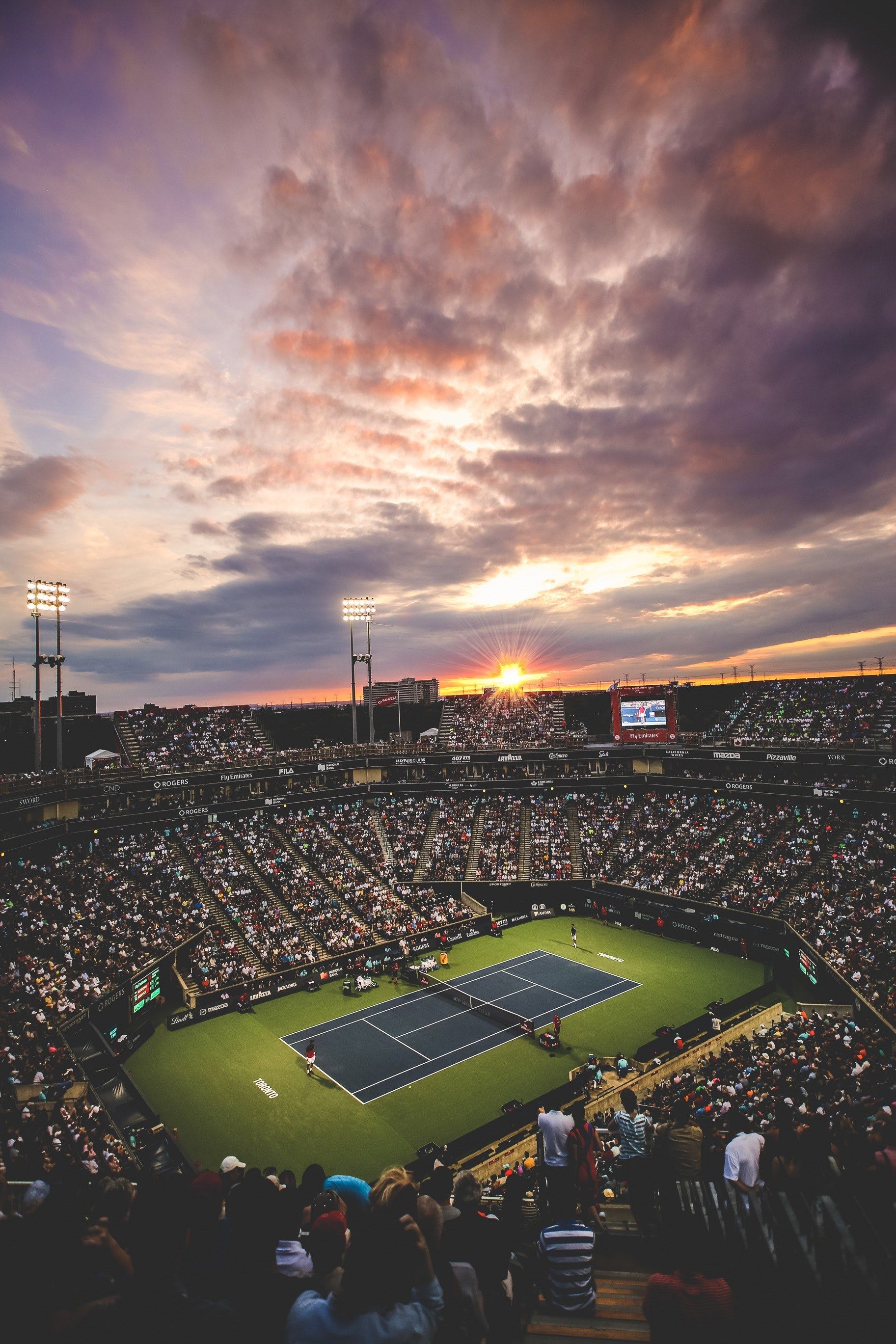 A tennis match is being played in front of an audience - Tennis