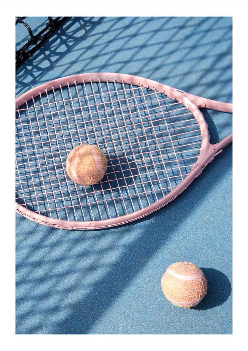 A tennis racket and two balls on the court - Tennis