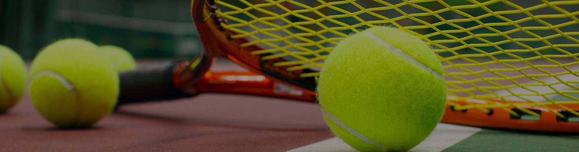 Tennis racquet and tennis balls on a tennis court - Tennis