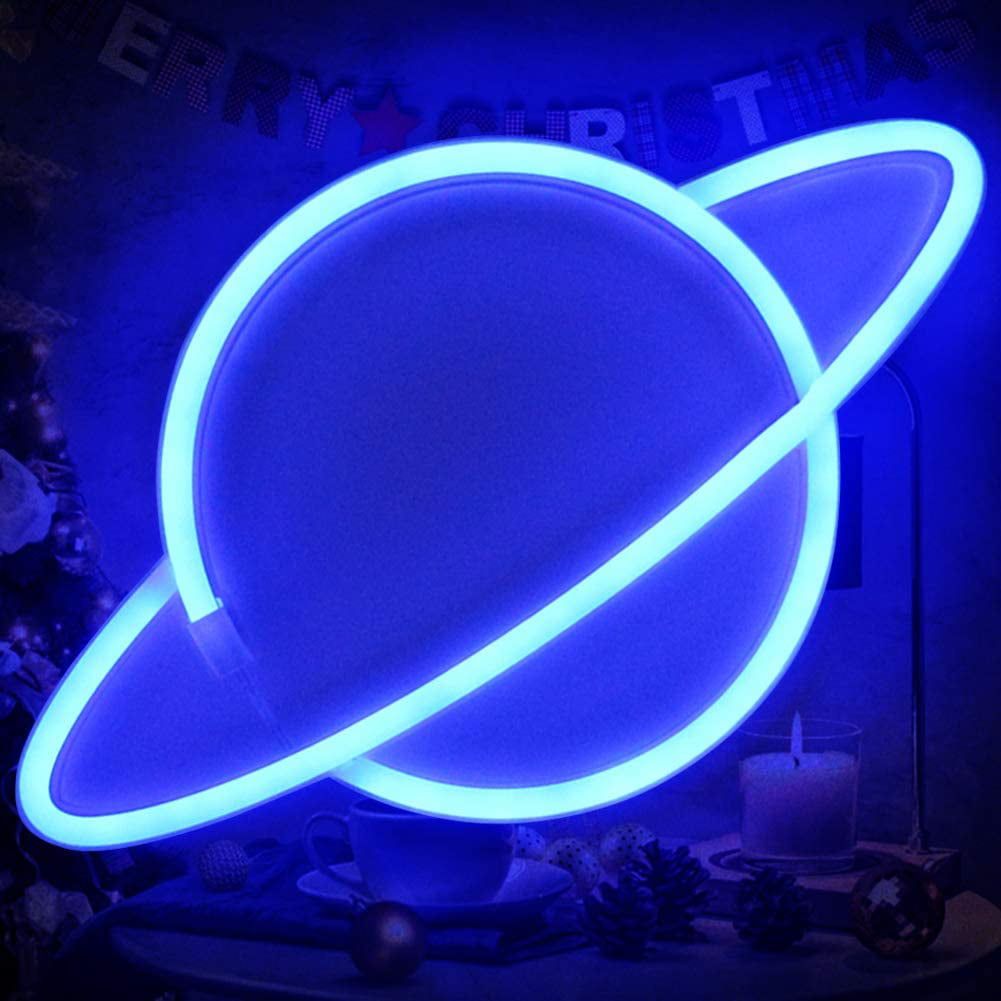 A blue neon Saturn sign on a table - Neon blue